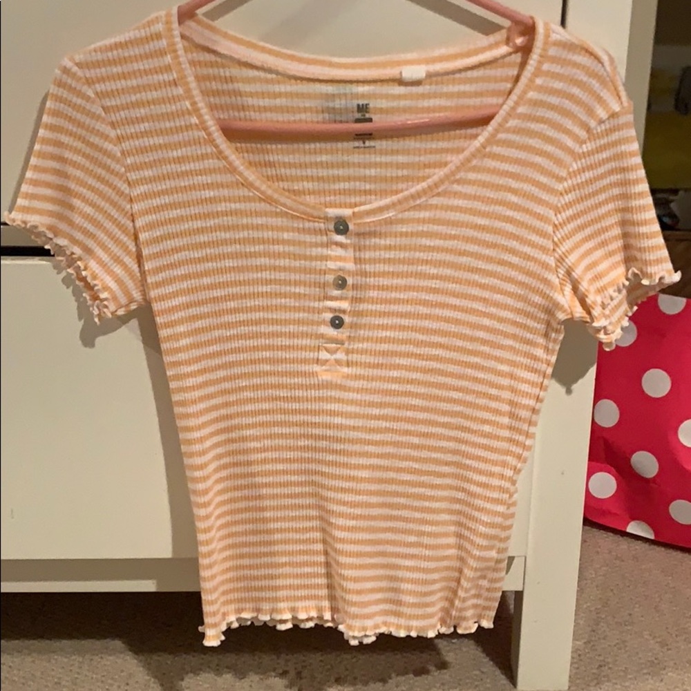 Orange and white striped shirt.